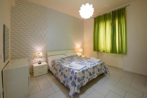 En eller flere senge i et værelse på Casa Vacanze L'Onda