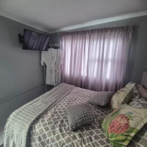 Ένα ή περισσότερα κρεβάτια σε δωμάτιο στο White Lilly