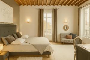 a bedroom with a bed and a chair and a window at Maunoury Citybreak in Chartres