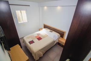 Ένα ή περισσότερα κρεβάτια σε δωμάτιο στο Coqueto Apartamento 50m de playa