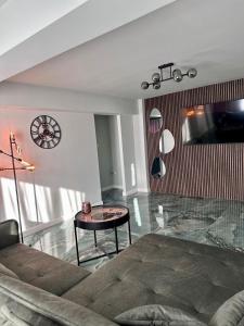 a living room with a couch and a table at GZP Residence Lugoj in Lugoj