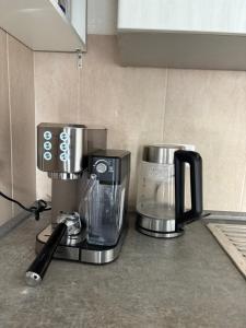 a coffee maker on a counter in a kitchen at Small House park free at street in Stuttgart
