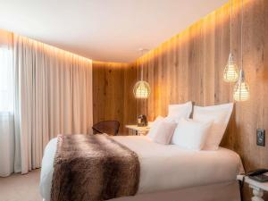 Ένα ή περισσότερα κρεβάτια σε δωμάτιο στο Mercure Valence