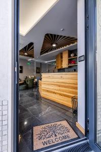 a view of the entrance to a mexican restaurant with a welcome mat in at Acacia Hotel in Sofia