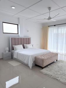 Ένα ή περισσότερα κρεβάτια σε δωμάτιο στο The Altura Apartment