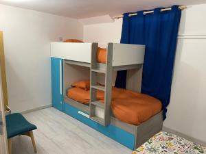 a bunk bed with two bunk beds in a room at Underground appart in Saint-Sébastien-sur-Loire