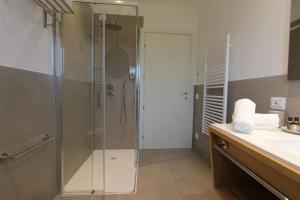 a bathroom with a shower and a sink at LA MUELE Affittacamere in Gemona del Friuli +18 photos