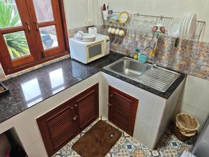 Dapur atau dapur kecil di Passara Wooden House