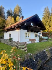 a white house with a fence in front of it at Villa Helga Am Steinernem Meer in Saalfelden am Steinernen Meer