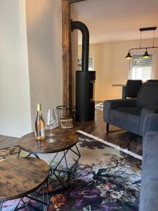 a living room with a couch and a stove at Ferienwohnung Clemens in Ediger-Eller +7 photos