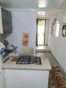 a kitchen with a stove top in a room at Casa Del Amor in Al Karm