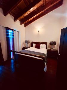 Giường trong phòng chung tại Villa Corsua