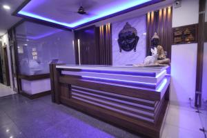 a museum with a statue and a mask on the wall at The Holy Stay in Haridwār