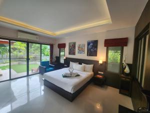 Postel nebo postele na pokoji v ubytování Khaolak Yama Resort - SHA Plus + 100 fotografií