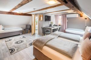 Postel nebo postele na pokoji v ubytování Hotel Nürnberger Hof in Altdorf + 27 fotografií