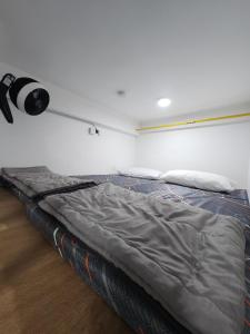 Postel nebo postele na pokoji v ubytování The Executive 27 by MySky Putrajaya + 10 fotografií