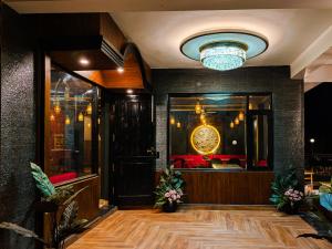 a lobby with a chandelier and a room at Heavenly Retreat, Shangarh in Shangarh