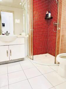 a bathroom with a shower and a sink and a toilet at egolife in Beijing