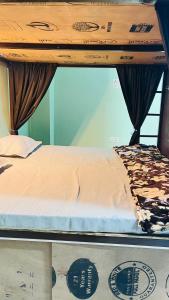 a bed on top of a bunk bed at REST POINT Dormitory in Jaipur