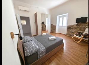 Katil atau katil-katil dalam bilik di Greta Guest House