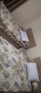 Ένα ή περισσότερα κρεβάτια σε δωμάτιο στο جولدن طيبه الذهبيه