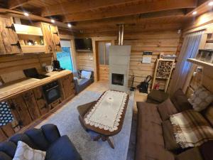 a living room with a couch and a table at Tammetalu puhkemaja 