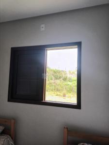 Μια τηλεόραση ή/και κέντρο ψυχαγωγίας στο Quarto Twin em Siderópolis apenas HOMENS, a 10 min de Nova Veneza