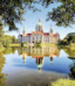 a large building sitting on top of a body of water at Residence Amira in Hannover