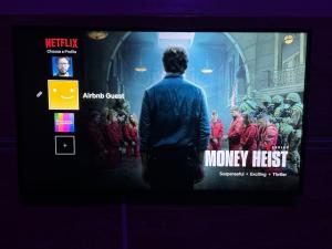 a man standing in front of a movie screen at Cozy & Chic Agadir Netflix, Beach & Comfort in Agadir +45 photos