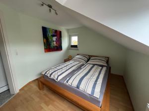 a bedroom with a bed in a attic at Ferienwohnung in Gütersloh in Gütersloh