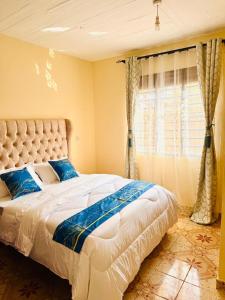 Ένα ή περισσότερα κρεβάτια σε δωμάτιο στο Danville Diani