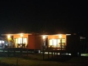 a house with a deck at night at Baan Seaview Sunset in Ko Lanta +80 photos