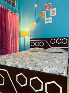a bedroom with a bed in a room at Destiny Home stay in Tezpur