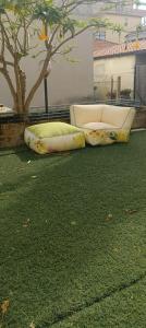 two inflatablelatable beds sitting on the grass at La tartaruga in Montesilvano +9 photos