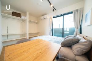 Postel nebo postele na pokoji v ubytování unito residence HAKATA Port 201