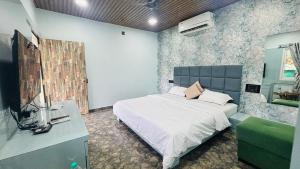 Postel nebo postele na pokoji v ubytování Venkateshwara Jungle Resort