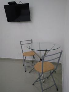 Hotel Boutique Santorini Class的电视和/或娱乐中心