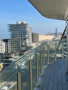 a view of a city from the balcony of a building at Spacious and modern apartment with open sea view in Ostend