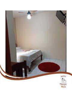 Postel nebo postele na pokoji v ubytování Hotel Estalagem Mineira Cambuí MG + 1 fotografie