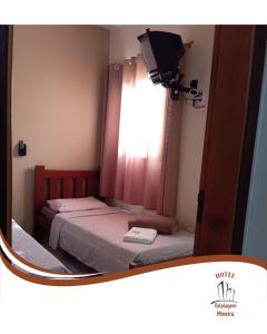 Postel nebo postele na pokoji v ubytování Hotel Estalagem Mineira Cambuí MG