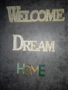 a poster for the movie welcome to dream home at DREAM Home Ioannina in Ioannina