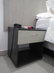 Hotel Boutique Santorini Class客房内的一张或多张床位