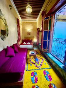 Ένα ή περισσότερα κρεβάτια σε δωμάτιο στο Riad Dar Lalj Fes