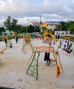 a group of children playing in a playground at SK S Haven #1 in Castries