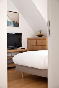 Postel nebo postele na pokoji v ubytování Luxoise Apartments