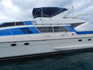 a large yacht is docked in the water at Yacht Charter Pattaya Ocean Marina Resort in Na Jomtien +86 photos