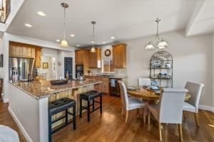 a kitchen and dining room with a table and chairs at 1144 Equinox in Colorado Springs