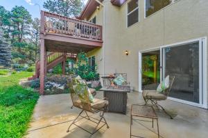 a patio with two chairs and a balcony at 120 Winding Meadow in Monument