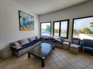 a living room with a couch and a table at Cabo dream in Cabo Negro