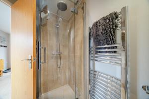 a shower in a bathroom with a glass shower stall at The Annex @ 3 East Town Cottages in West Ashton +32 photos